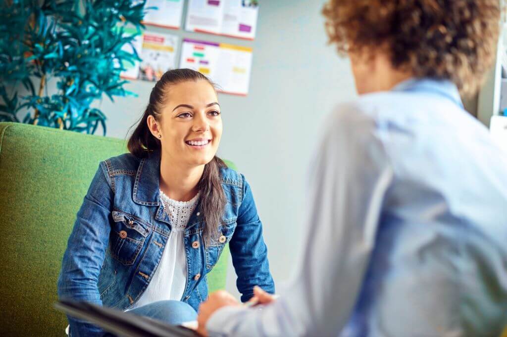 Woman receiving pro bono advice from adviser 